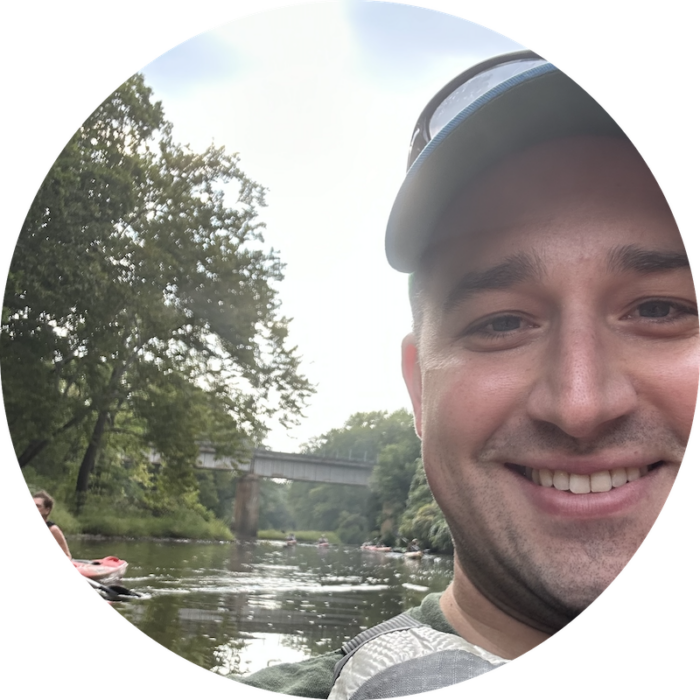 Logan Heley kayaking on the Blue River